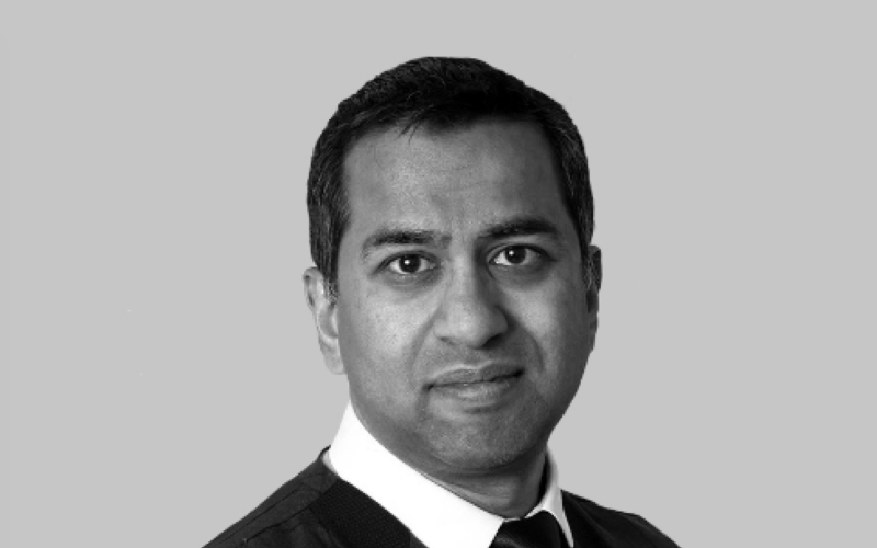 Black and white photo of Dowshan Humzah, independent board director and transformation specialist