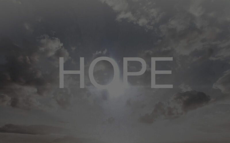 A cloudy and sunny sky with the word hope written in the foreground